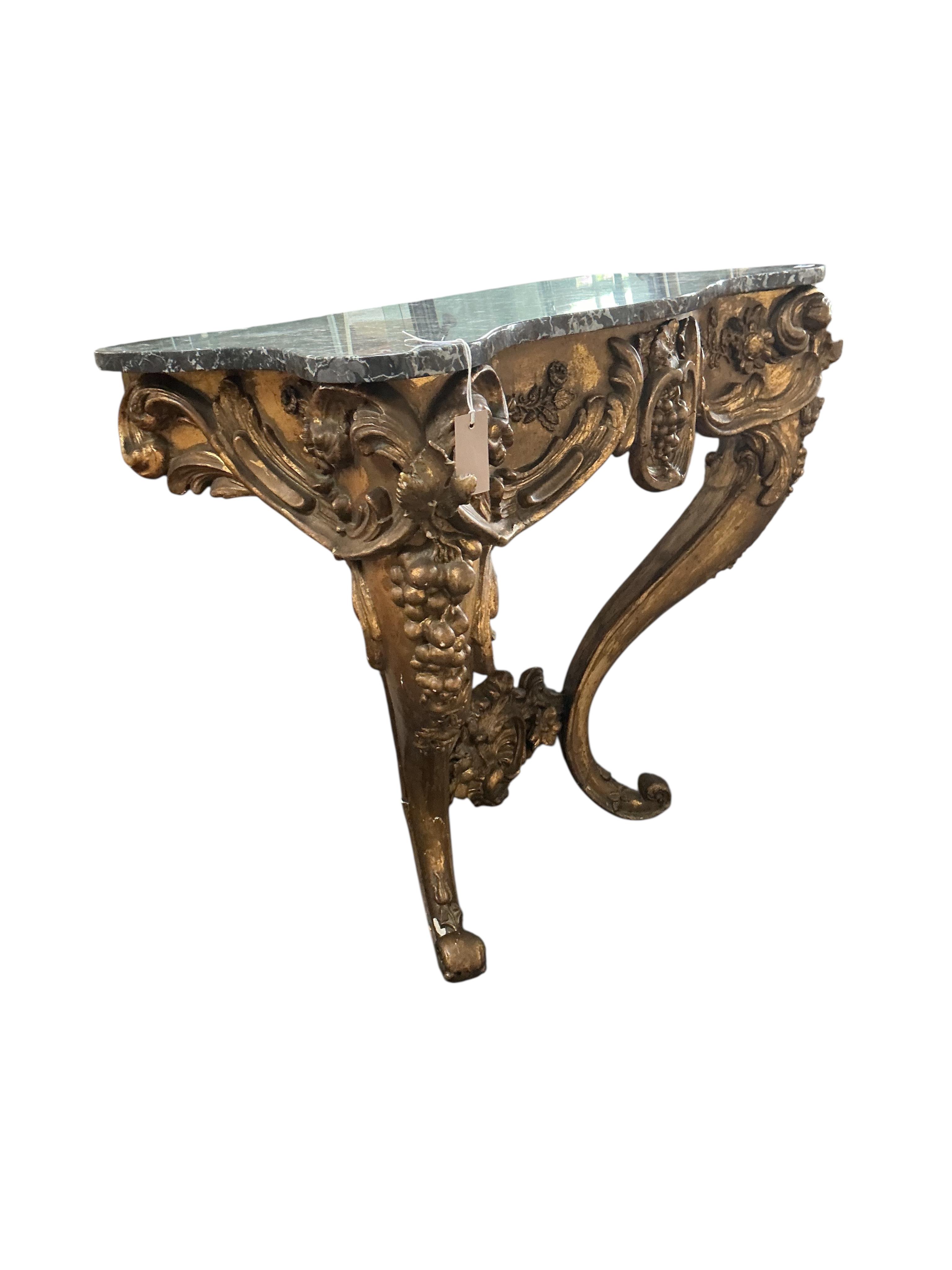An 18th century Italian carved giltwood serpentine console table with associated marble top, width 85cm, depth 50cm, height 95cm